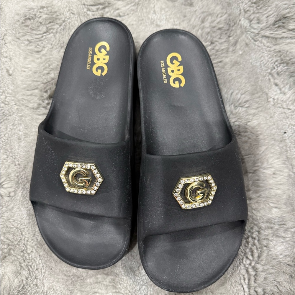 GBG Los Angeles Black Sandals with Gold Accent